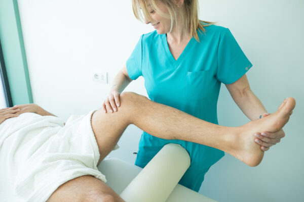 Electromagnetic therapy of the back, physiotherapist doctor uses medical equipment. Electromagnetic therapy of the back, physiotherapist doctor uses medical equipment for highly effective pain treatment and inflammation back, the magnetic field, rehabilitation.